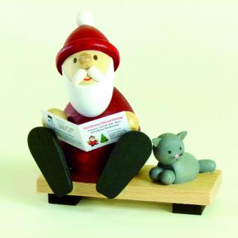 Paul Ullrich Weihnachtsmann auf Bank mit Zeitung und Katze 
