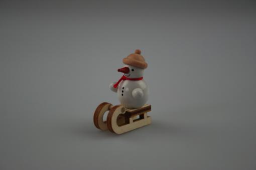Miniatur Schneemann auf Schlitten 