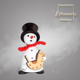 Hennig Miniaturen Schneemann mit Schaukelpferd 